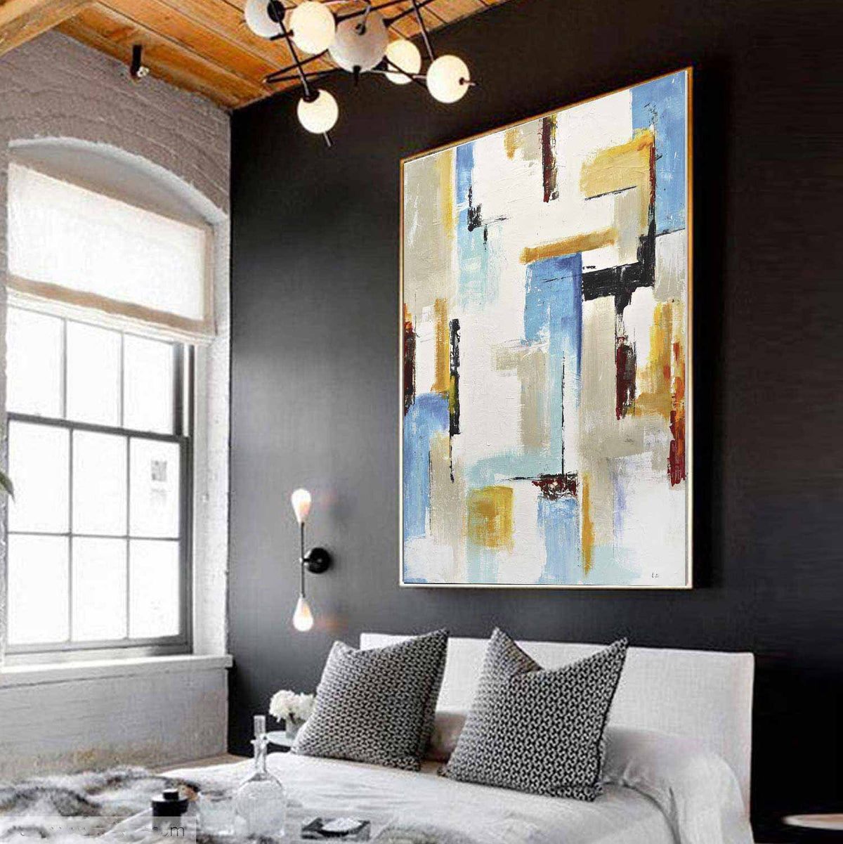 vertical artwork above bed